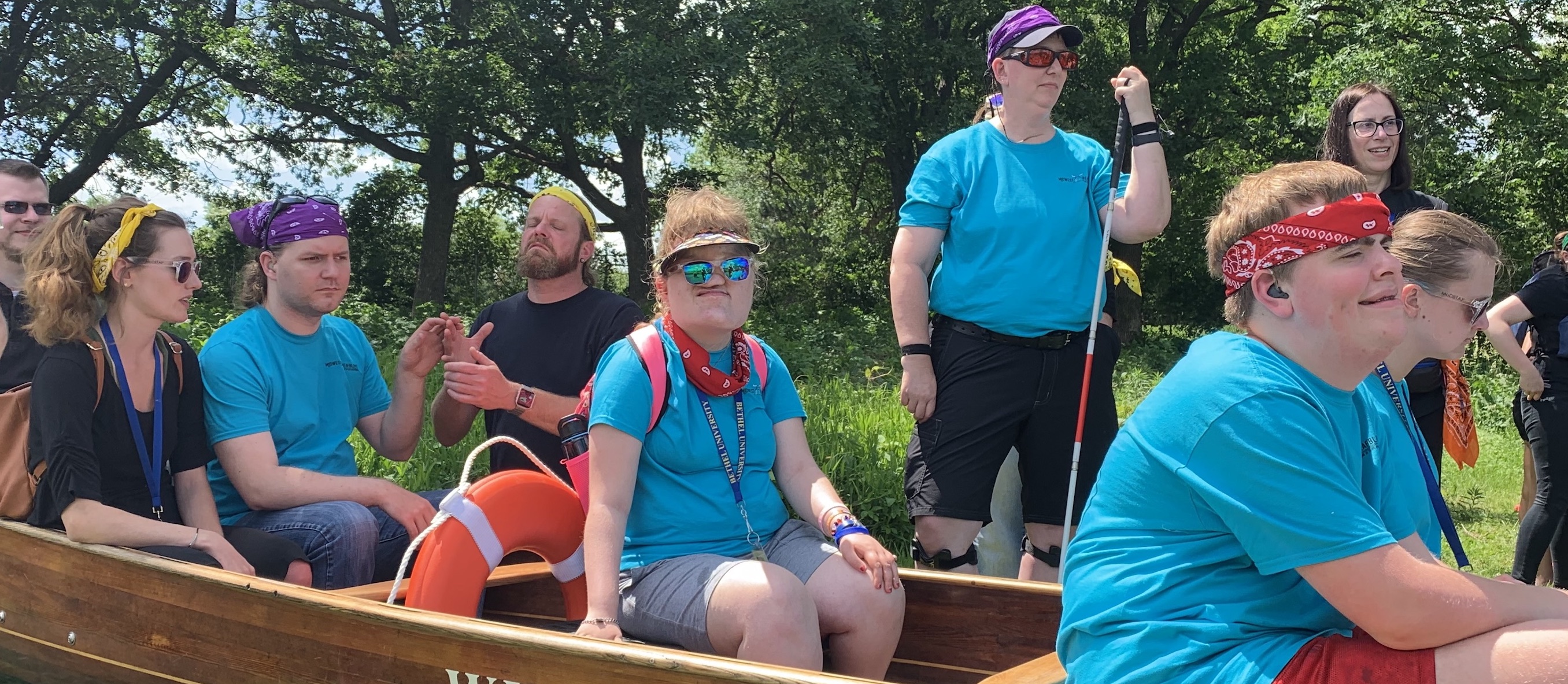 Young adults prepare to go canoeing.